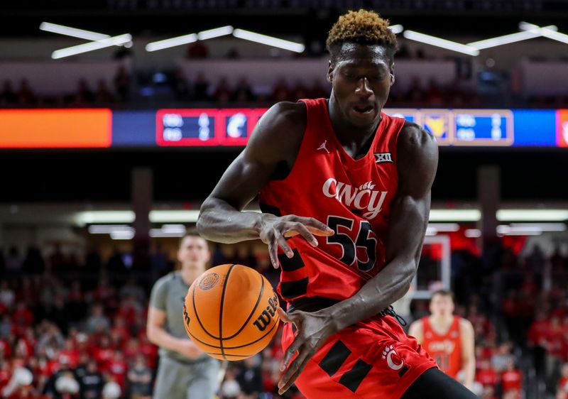 Mar 9, 2024; Cincinnati, Ohio, USA; Cincinnati Bearcats forward Aziz Bandaogo (55) plays the court against the West Virginia Mountaineers in the first half at Fifth Third Arena. Mandatory Credit: Katie Stratman-USA TODAY Sports