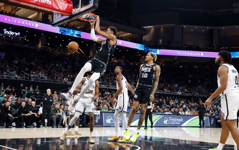 SAN ANTONIO, TX - MARCH 17  Victor Wembanyama #1 of the San Antonio Spurs dunks on the Brooklyn Nets in the first half at Moody Center on March 17, 2024 in San Antonio, Texas. NOTE TO USER: User expressly acknowledges and agrees that, by downloading and or using this photograph, User is consenting to terms and conditions of the Getty Images License Agreement. (Photo by Ronald Cortes/Getty Images)