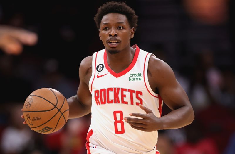 HOUSTON, TEXAS - OCTOBER 07: Jae'Sean Tate #8 of the Houston Rockets controls the ball against the Toronto Raptors during the first half at Toyota Center on October 07, 2022 in Houston, Texas. NOTE TO USER: User expressly acknowledges and agrees that, by downloading and or using this photograph, User is consenting to the terms and conditions of the Getty Images License Agreement. (Photo by Carmen Mandato/Getty Images)