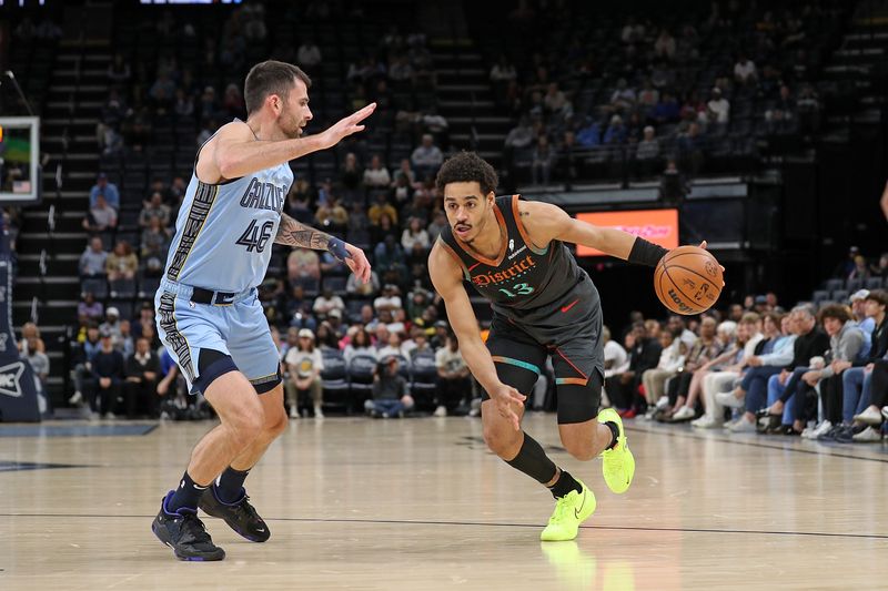 MEMPHIS, TENNESSEE - MARCH 12: Jordan Poole #13 of the Washington Wizards drives to the basket against John Konchar #46 of the Memphis Grizzlies during the first half at FedExForum on March 12, 2024 in Memphis, Tennessee. NOTE TO USER: User expressly acknowledges and agrees that, by downloading and or using this photograph, User is consenting to the terms and conditions of the Getty Images License Agreement. (Photo by Justin Ford/Getty Images)