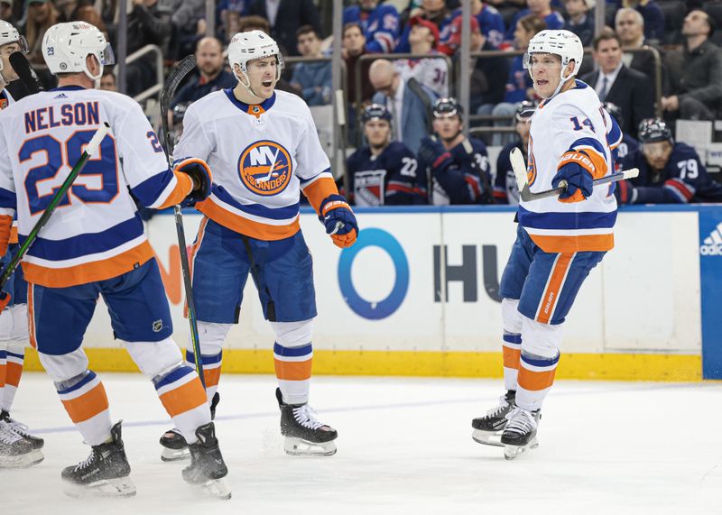 Mar 17, 2024; New York, New York, USA; New York Islanders center Bo Horvat (14) celebrates his goal with teammates during the first period against the New York Rangers at Madison Square Garden. Mandatory Credit: Vincent Carchietta-USA TODAY Sports