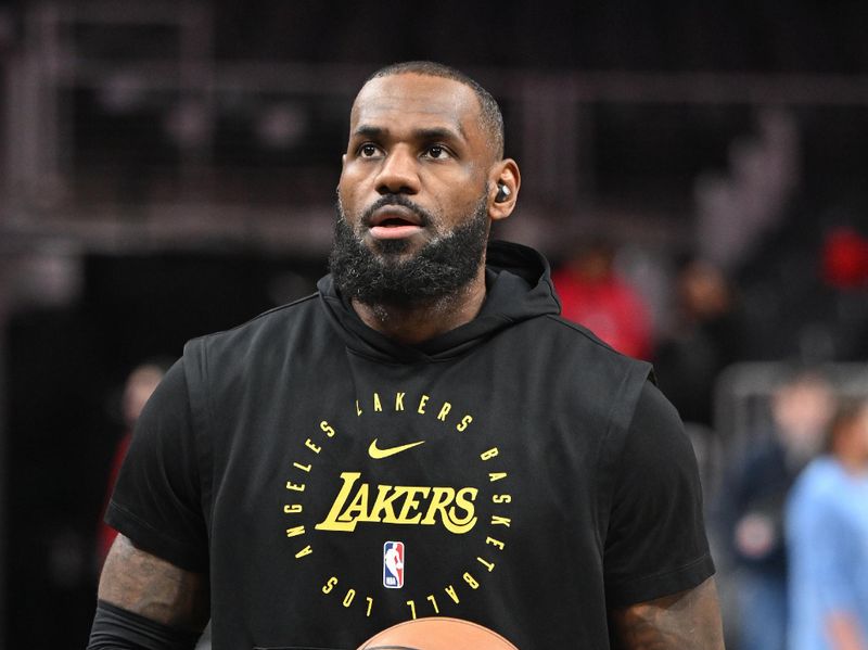 ATLANTA, GEORGIA - DECEMBER 6: LeBron James #23 of the Los Angeles Lakers warms up before the game against the Atlanta Hawks on December 6, 2024 at State Farm Arena in Atlanta, Georgia. NOTE TO USER: User expressly acknowledges and agrees that, by downloading and/or using this photograph, user is consenting to the terms and conditions of the Getty Images License Agreement.  (Photo by Paras Griffin/Getty Images)