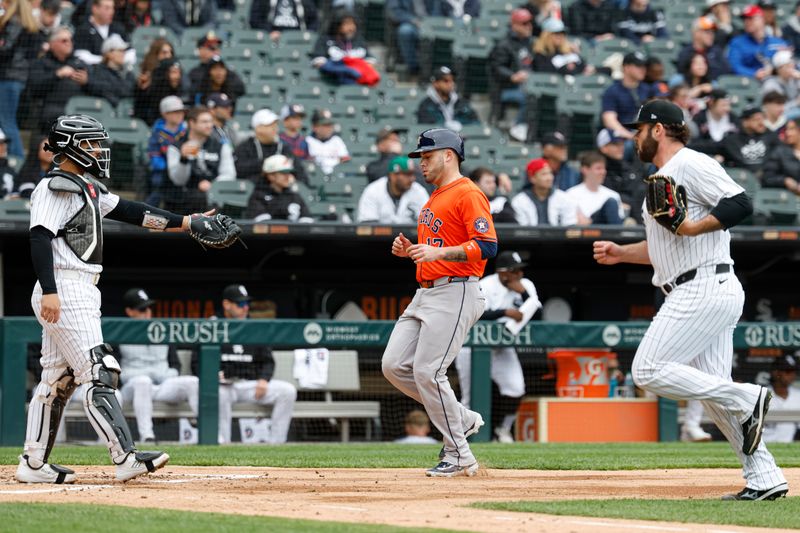 May 4, 2025; Chicago, Illinois, USA; Houston Astros catcher Victor Caratini (17) scores against the Chicago White Sox during the second inning at Rate Field. Mandatory Credit: Kamil Krzaczynski-Imagn Images