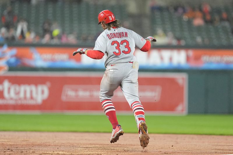 May 28, 2025; Baltimore, Maryland, USA; St. Louis Cardinals second baseman Brendan Donovan (33) reacts to hitting a two run home run as he rounds the bases against the Baltimore Orioles during the fifth inning at Oriole Park at Camden Yards. Mandatory Credit: Gregory Fisher-Imagn Images