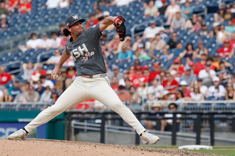 May 25, 2024; Washington, District of Columbia, USA; Washington Nationals relief pitcher Kyle Finnegan (67) pitches against the Seattle Mariners during the ninth inning at Nationals Park. Mandatory Credit: Geoff Burke-USA TODAY Sports