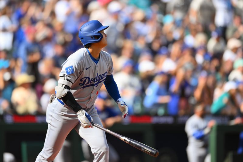 Sep 28, 2025; Seattle, Washington, USA; Los Angeles Dodgers designated hitter Shohei Ohtani (17) hits a home run against the Seattle Mariners during the seventh inning at T-Mobile Park. Mandatory Credit: Steven Bisig-Imagn Images