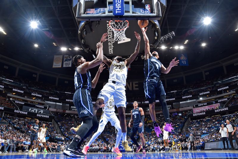 ORLANDO, FL - OCTOBER 28: Jalen Suggs #4 of the Orlando Magic goes up for the rebound during the game against the Indiana Pacers on October 28, 2024 at Kia Center in Orlando, Florida. NOTE TO USER: User expressly acknowledges and agrees that, by downloading and or using this photograph, User is consenting to the terms and conditions of the Getty Images License Agreement. Mandatory Copyright Notice: Copyright 2024 NBAE (Photo by Fernando Medina/NBAE via Getty Images)