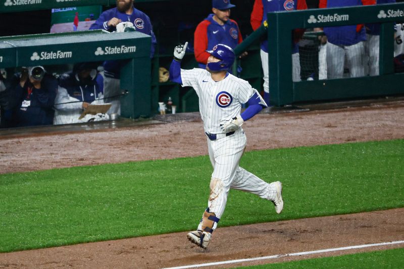 Jun 1, 2024; Chicago, Illinois, USA; Chicago Cubs outfielder Seiya Suzuki (27) rounds the bases after hitting a grand slam against the Cincinnati Reds during the second inning at Wrigley Field. Mandatory Credit: Kamil Krzaczynski-USA TODAY Sports