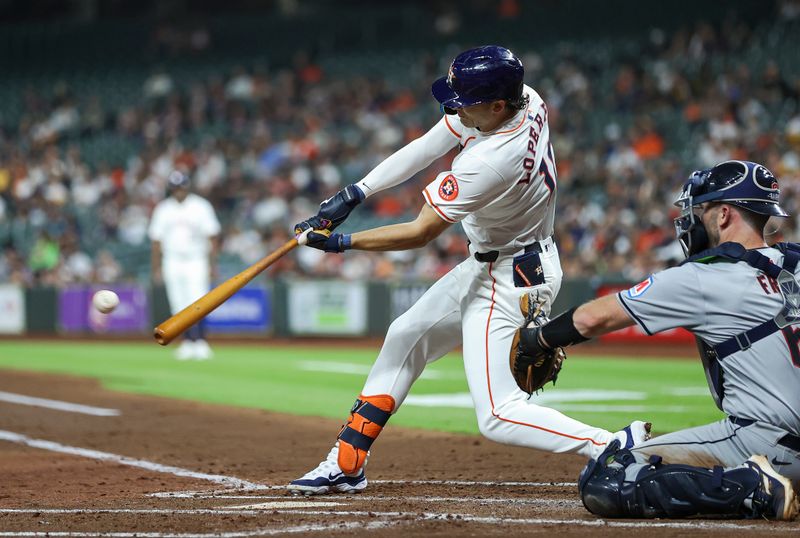 May 1, 2024; Houston, Texas, USA;  Houston Astros left fielder Joey Loperfido (10) hits a single during the third inning against the Cleveland Guardians at Minute Maid Park. Mandatory Credit: Troy Taormina-USA TODAY Sports