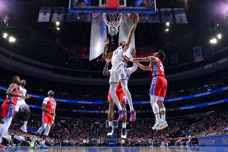 PHILADELPHIA, PA - NOVEMBER 22: Nicolas Claxton #33 of the Brooklyn Nets drives to the basket during the game against the Philadelphia 76ers during the Emirates NBA Cup game on November 22, 2024 at the Wells Fargo Center in Philadelphia, Pennsylvania NOTE TO USER: User expressly acknowledges and agrees that, by downloading and/or using this Photograph, user is consenting to the terms and conditions of the Getty Images License Agreement. Mandatory Copyright Notice: Copyright 2024 NBAE (Photo by Jesse D. Garrabrant/NBAE via Getty Images)