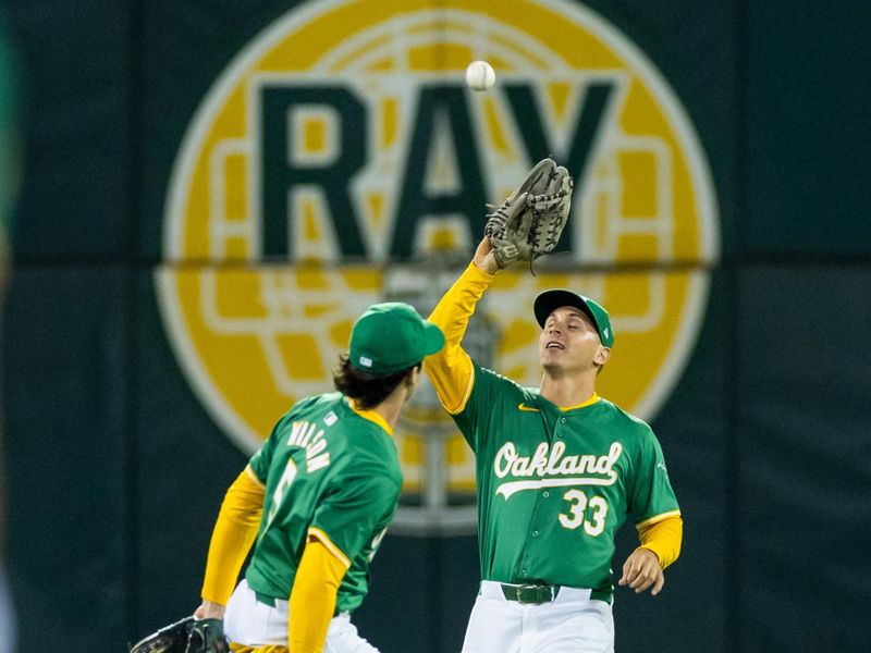 Sep 20, 2024; Oakland, California, USA; Oakland Athletics outfielder JJ Bleday (33) makes a catch during the eighth inning against the New York Yankees at Oakland-Alameda County Coliseum. Mandatory Credit: Bob Kupbens-Imagn Images