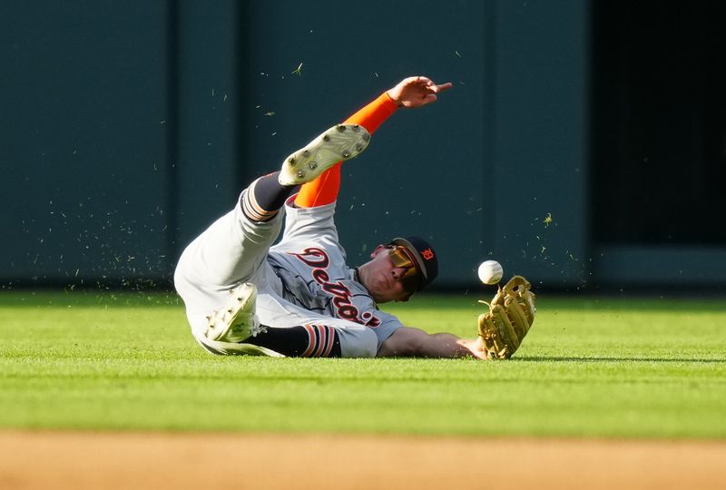 Jul 1, 2023; Denver, Colorado, USA; Detroit Tigers right fielder Kerry Carpenter (30) is unable to field the ball in the first inning against the Colorado Rockies at Coors Field. Mandatory Credit: Ron Chenoy-USA TODAY Sports