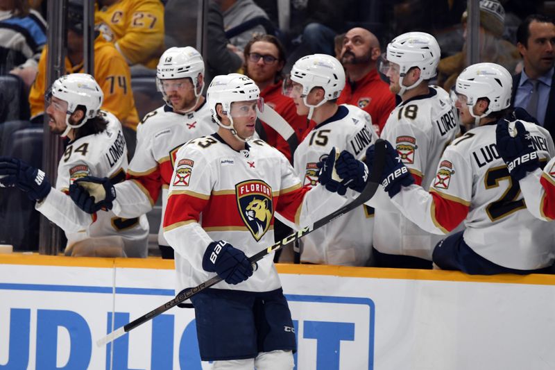 Jan 22, 2024; Nashville, Tennessee, USA; Florida Panthers center Carter Verhaeghe (23) is congratulated by teammates after a goal during the third period against the Nashville Predators at Bridgestone Arena. Mandatory Credit: Christopher Hanewinckel-USA TODAY Sports