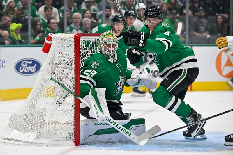 May 5, 2024; Dallas, Texas, USA; Dallas Stars goaltender Jake Oettinger (29) and defenseman Miro Heiskanen (4) faces the Vegas Golden Knights attack during the first period in game seven of the first round of the 2024 Stanley Cup Playoffs at American Airlines Center. Mandatory Credit: Jerome Miron-USA TODAY Sports