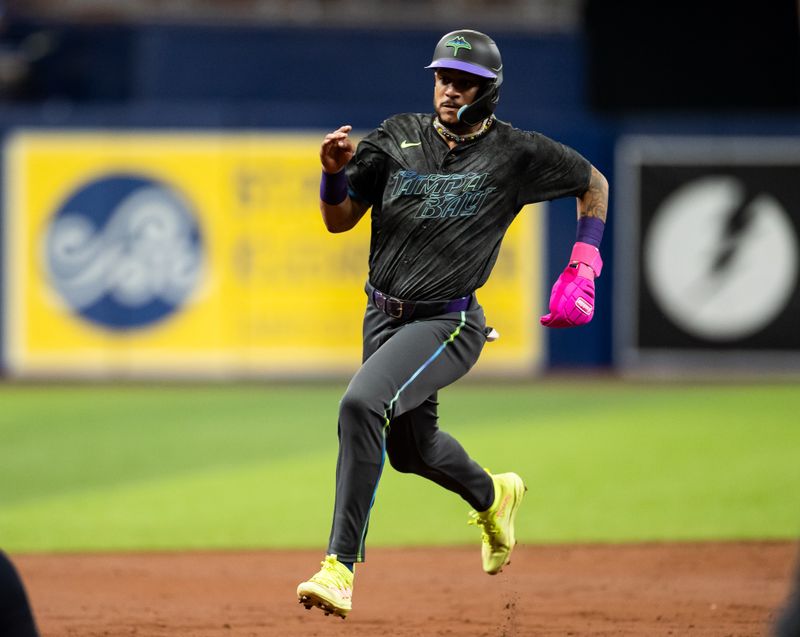 May 11, 2024; St. Petersburg, Florida, USA; Tampa Bay Rays outfielder Jose Siri (22) runs to third base against the New York Yankees during the third inning at Tropicana Field. Mandatory Credit: Matt Pendleton-USA TODAY Sports