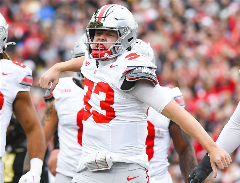 Oct 14, 2023; West Lafayette, Indiana, USA; Ohio State Buckeyes quarterback Devin Brown (33) celebrates after a touchdown during the first half at Ross-Ade Stadium. Mandatory Credit: Robert Goddin-USA TODAY Sports