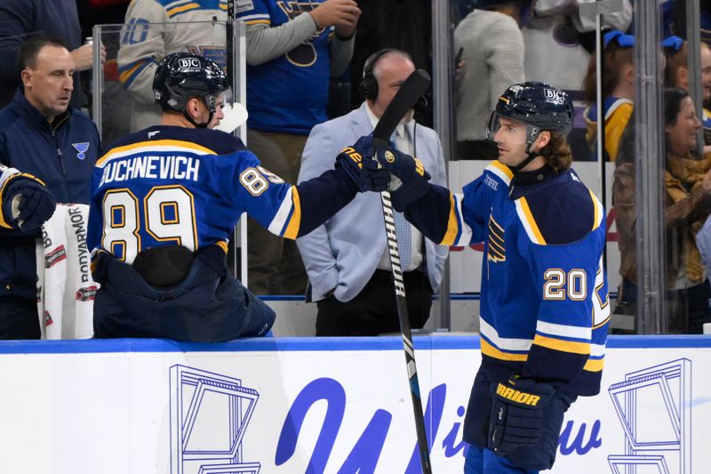 Oct 22, 2024; St. Louis, Missouri, USA; St. Louis Blues left wing Brandon Saad (20) is congratulated by left wing Pavel Buchnevich (89) after scoring a goal against the Winnipeg Jets during the first period at Enterprise Center. Mandatory Credit: Jeff Le-Imagn Images 