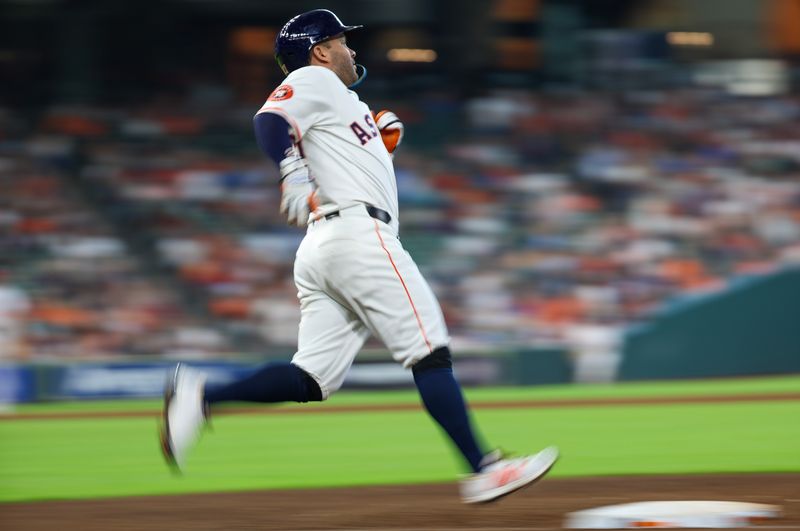 Jul 30, 2025; Houston, Texas, USA; Houston Astros second baseman Jose Altuve (27) runs to first base after hitting a single against the Washington Nationals in the fifth inning at Daikin Park. Mandatory Credit: Thomas Shea-Imagn Images