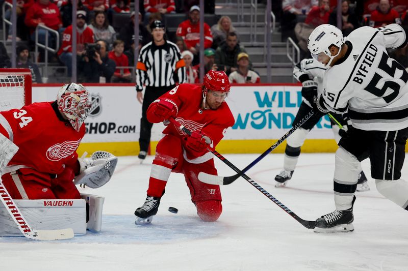 Jan 13, 2024; Detroit, Michigan, USA;  Los Angeles Kings right wing Quinton Byfield (55) shoots and scores on Detroit Red Wings goaltender Alex Lyon (34) in the first period at Little Caesars Arena. Mandatory Credit: Rick Osentoski-USA TODAY Sports