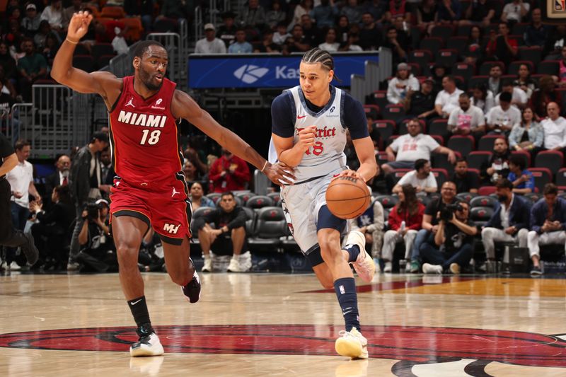 MIAMI, FL - MARCH 3:  Kyshawn George #18 of the Washington Wizards dribbles the ball during the game against the Miami Heat on March 3, 2025 at Kaseya Center in Miami, Florida. NOTE TO USER: User expressly acknowledges and agrees that, by downloading and or using this Photograph, user is consenting to the terms and conditions of the Getty Images License Agreement. Mandatory Copyright Notice: Copyright 2025 NBAE (Photo by Issac Baldizon/NBAE via Getty Images)