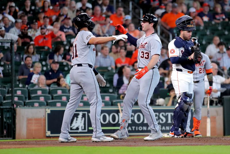 Apr 30, 2025; Houston, Texas, USA; Detroit Tigers first baseman Colt Keith (33) is congratulated by Detroit Tigers right fielder Riley Greene (31) after hitting a two-run home run against the Houston Astros during the second inning at Daikin Park. Mandatory Credit: Erik Williams-Imagn Images