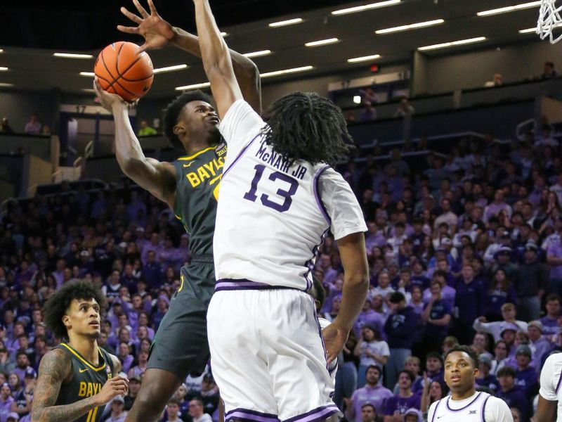 Jan 16, 2024; Manhattan, Kansas, USA; Baylor Bears center Yves Missi (21) shoots against Kansas State Wildcats center Will McNair Jr. (13) during the second half at Bramlage Coliseum. Mandatory Credit: Scott Sewell-USA TODAY Sports