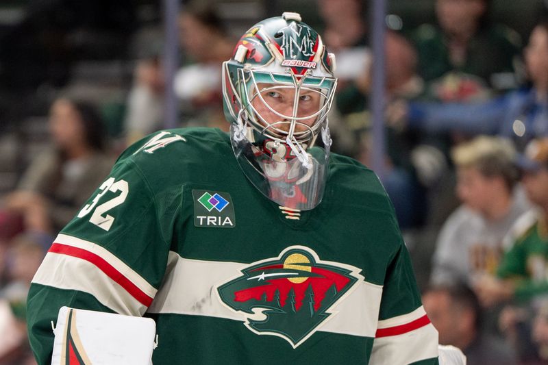 Oct 1, 2024; Saint Paul, Minnesota, USA; Minnesota Wild goaltender Filip Gustavsson (32) during a break in the action against the Chicago Blackhawks in the first period at Xcel Energy Center. Mandatory Credit: Matt Blewett-Imagn Images