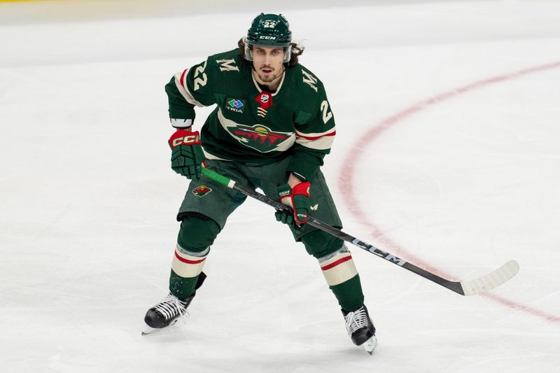 Apr 18, 2024; Saint Paul, Minnesota, USA; Minnesota Wild center Marat Khusnutdinov (22) skates against the Seattle Kraken in the second period at Xcel Energy Center. Mandatory Credit: Matt Blewett-USA TODAY Sports