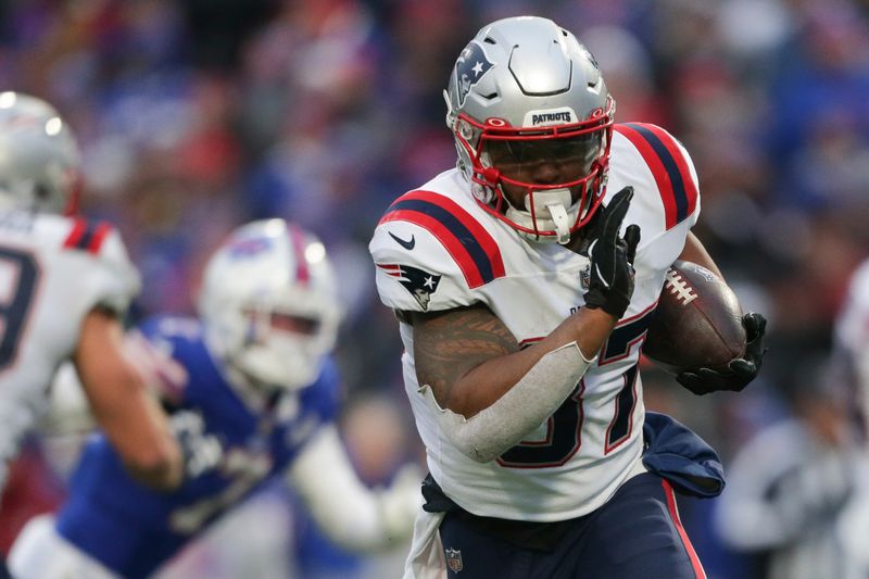 FILE -New England Patriots running back Damien Harris (37) runs during the second half of an NFL football game against the Buffalo Bills on Sunday, Jan. 8, 2023, in Orchard Park, N.Y. The Buffalo Bills restocked their offensive backfield by signing free agent Damien Harris to a one-year contract on Tuesday, March 21, 2023. Harris spent his first four NFL seasons with Buffalo's division rival New England Patriots, and his signing comes a day after Buffalo lost starter Devin Singletary, who signed with Houston. (AP Photo/Joshua Bessex, File)