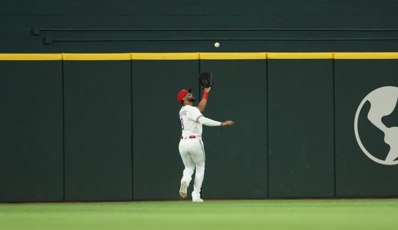 Jun 28, 2023; Arlington, Texas, USA;  Texas Rangers center fielder Leody Taveras (3) makes a catch during the first inning against the Detroit Tigers at Globe Life Field. Mandatory Credit: Kevin Jairaj-USA TODAY Sports