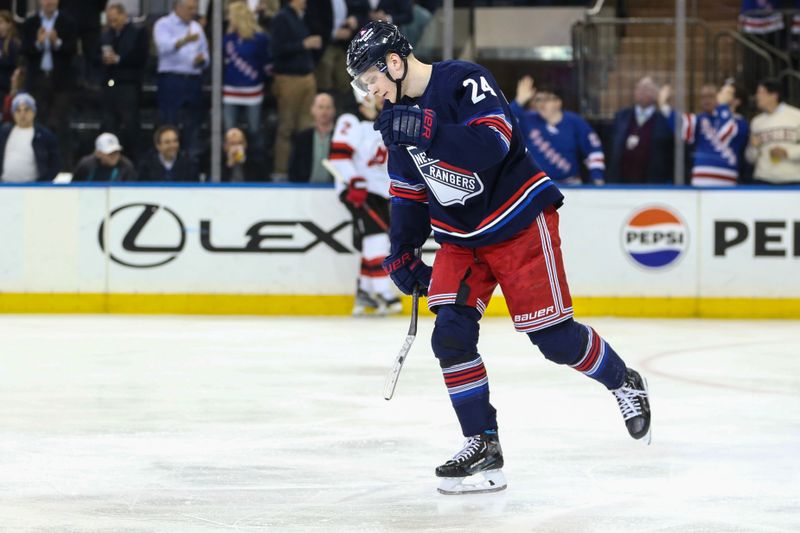 Apr 3, 2024; New York, New York, USA; New York Rangers right wing Kaapo Kakko (24) skates back to the bench after scoring a goal in the third period against the New Jersey Devils at Madison Square Garden. Mandatory Credit: Wendell Cruz-USA TODAY Sports