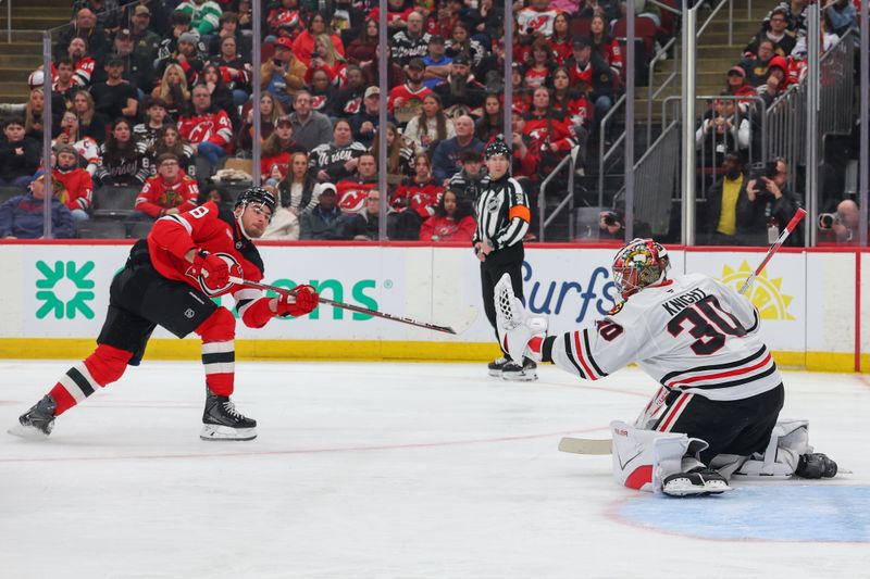 Mar 29, 2026; Newark, New Jersey, USA; Chicago Blackhawks goaltender Spencer Knight (30) makes a save on New Jersey Devils right wing Timo Meier (28) during the second period at Prudential Center. Mandatory Credit: Ed Mulholland-Imagn Images