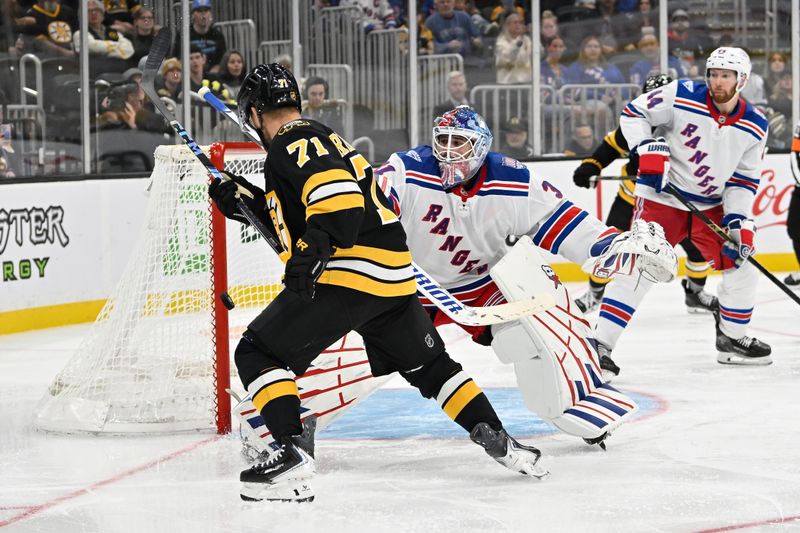 Oct 4, 2025; Boston, Massachusetts, USA; New York Rangers goaltender Igor Shesterkin (31) makes a save as Boston Bruins left wing Viktor Arvidsson (71) tries to gather the rebounding puck during the third period period at TD Garden. Mandatory Credit: Eric Canha-Imagn Images