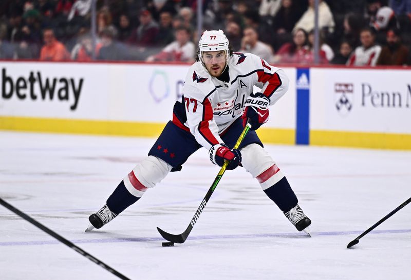 Dec 14, 2023; Philadelphia, Pennsylvania, USA; Washington Capitals right wing T.J. Oshie (77) controls the puck against the Philadelphia Flyers in the second period at Wells Fargo Center. Mandatory Credit: Kyle Ross-USA TODAY Sports