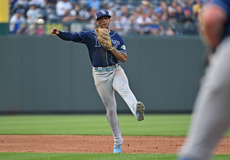 Jul 15, 2023; Kansas City, Missouri, USA;  Tampa Bay Rays shortstop Wander Franco (5) throws the ball to first base for an out in the third inning against the Kansas City Royals at Kauffman Stadium. Mandatory Credit: Peter Aiken-USA TODAY Sports