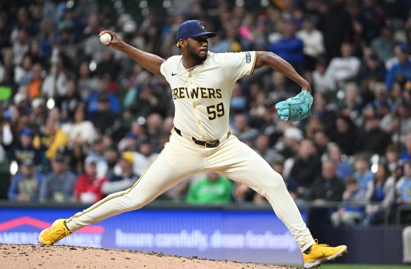 Apr 26, 2024; Milwaukee, Wisconsin, USA; Milwaukee Brewers pitcher Elvis Peguero (59) delivers a pitch against the New York Yankees in the eighth inning at American Family Field. Mandatory Credit: Michael McLoone-USA TODAY Sports