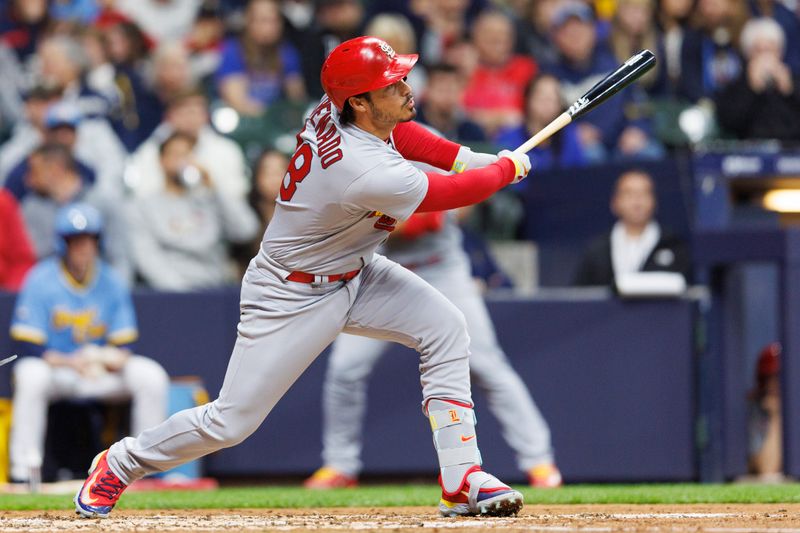 Apr 7, 2023; Milwaukee, Wisconsin, USA;  St. Louis Cardinals third baseman Nolan Arenado (28) singles during the fourth inning against the Milwaukee Brewers at American Family Field. Mandatory Credit: Jeff Hanisch-USA TODAY Sports