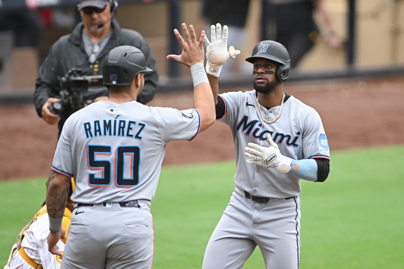 May 28, 2025; San Diego, California, USA; Miami Marlins second baseman Otto Lopez (6) is congratulated by  Agustin Ramirez (50) after hitting a three-run home run during the fifth inning against the San Diego Padres at Petco Park. Mandatory Credit: Denis Poroy-Imagn Images