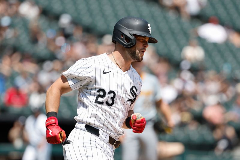 Jul 14, 2024; Chicago, Illinois, USA; Chicago White Sox outfielder Andrew Benintendi (23) rounds the bases after hitting a solo home run against the Pittsburgh Pirates during the third inning at Guaranteed Rate Field. Mandatory Credit: Kamil Krzaczynski-USA TODAY Sports