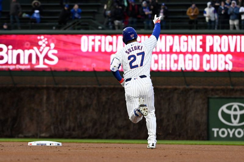 Apr 2, 2024; Chicago, Illinois, USA; Chicago Cubs right fielder Seiya Suzuki (27) points after hitting a two-run home run against the Colorado Rockies during the first inning at Wrigley Field. Mandatory Credit: Matt Marton-USA TODAY Sports