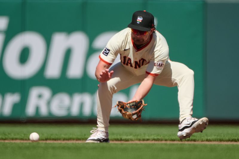 Jun 15, 2024; San Francisco, California, USA; San Francisco Giants infielder Brett Wisely (0) fields a ground ball against the Los Angeles Angels during the ninth inning at Oracle Park. Mandatory Credit: Robert Edwards-USA TODAY Sports