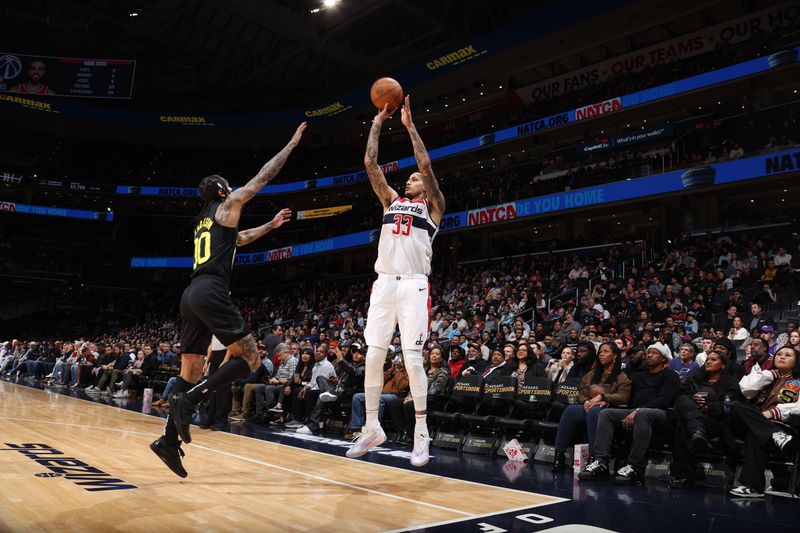 WASHINGTON, DC -? JANUARY 25: Kyle Kuzma #33 of the Washington Wizards shoots a three point basket during the game against the Utah Jazz on January 25, 2024 at Capital One Arena in Washington, DC. NOTE TO USER: User expressly acknowledges and agrees that, by downloading and or using this Photograph, user is consenting to the terms and conditions of the Getty Images License Agreement. Mandatory Copyright Notice: Copyright 2024 NBAE (Photo by Stephen Gosling/NBAE via Getty Images)