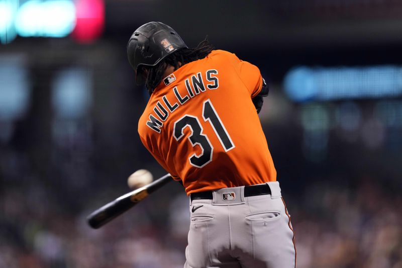 Sep 2, 2023; Phoenix, Arizona, USA; Baltimore Orioles center fielder Cedric Mullins (31) hits a three run home run against the Arizona Diamondbacks during the fourth inning at Chase Field. Mandatory Credit: Joe Camporeale-USA TODAY Sports