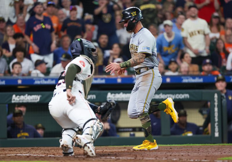 May 18, 2024; Houston, Texas, USA;Milwaukee Brewers third baseman Joey Ortiz (3) scores at home plate against Houston Astros catcher Yainer Diaz (21) in the fifth inning at Minute Maid Park. Mandatory Credit: Thomas Shea-USA TODAY Sports