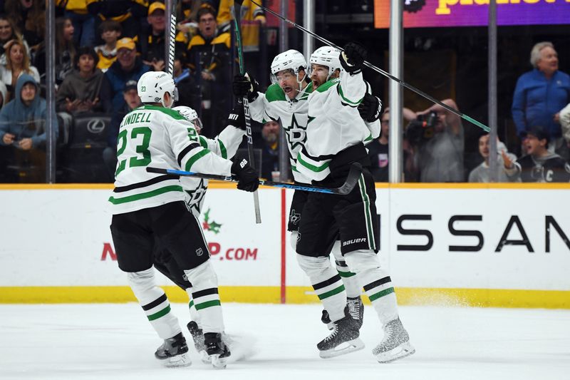 Dec 23, 2023; Nashville, Tennessee, USA; Dallas Stars defenseman Jani Hakanpaa (2) and center Craig Smith (15) celebrate with teammates after scoring the game-winning goal late in the third period to beat the Nashville Predators at Bridgestone Arena. Mandatory Credit: Christopher Hanewinckel-USA TODAY Sports