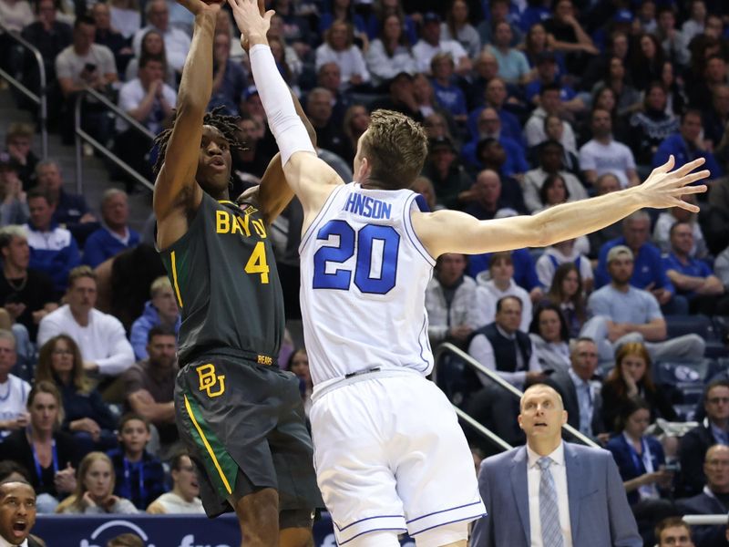 Feb 20, 2024; Provo, Utah, USA; Baylor Bears guard Ja'Kobe Walter (4) shoots over Brigham Young Cougars guard Spencer Johnson (20) during the first half at Marriott Center. Mandatory Credit: Rob Gray-USA TODAY Sports