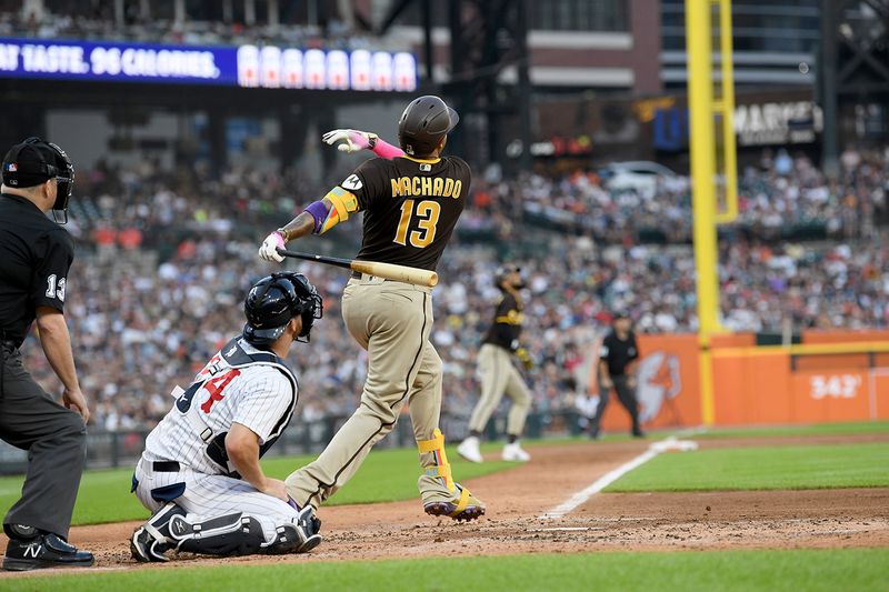 Jul 22, 2023; Detroit, Michigan, USA; San Diego Padres third baseman Manny Machado (13) hits a three-run home run against the Detroit Tigers in the third inning at Comerica Park. Mandatory Credit: Lon Horwedel-USA TODAY Sports