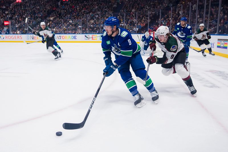 Jan 18, 2024; Vancouver, British Columbia, CAN; Arizona Coyotes forward Logan Cooley (92) pursues Vancouver Canucks forward J.T. Miller (9) in the first period at Rogers Arena. Mandatory Credit: Bob Frid-USA TODAY Sports
