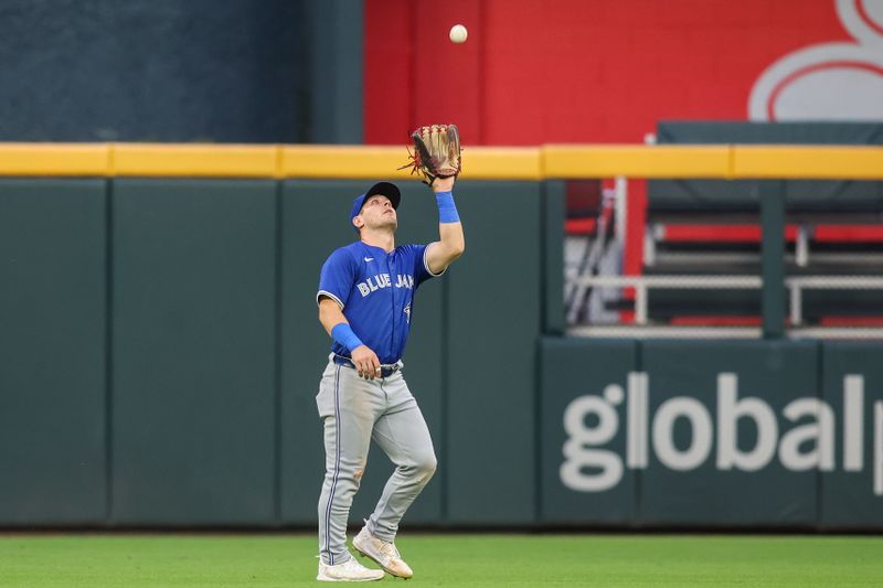 Sep 6, 2024; Atlanta, Georgia, USA; Toronto Blue Jays center fielder Daulton Varsho (25) catches a fly ball against the Atlanta Braves in the first inning at Truist Park. Mandatory Credit: Brett Davis-Imagn Images