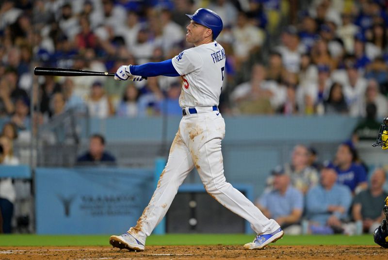 Aug 16, 2023; Los Angeles, California, USA;  Los Angeles Dodgers first baseman Freddie Freeman (5) doubles in a run in the sixth inning against the Milwaukee Brewers at Dodger Stadium. Mandatory Credit: Jayne Kamin-Oncea-USA TODAY Sports